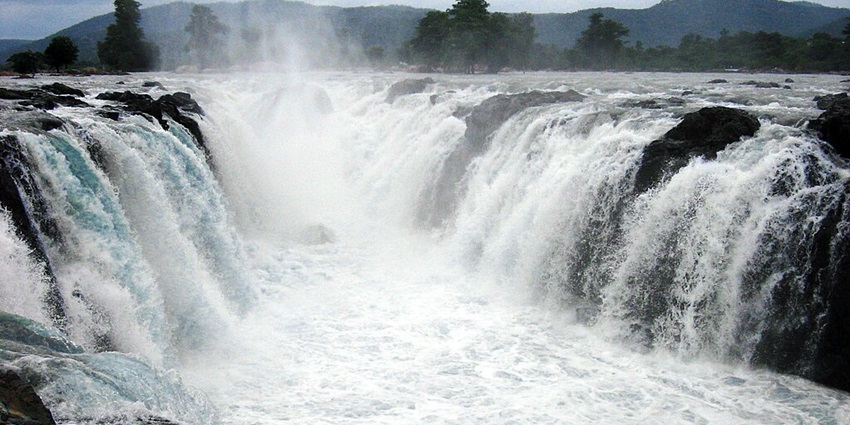 Picturesque waterfall surrounded by lush greenery and tranquillity