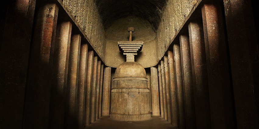 Inside the ancient Bedse caves with rock-cut designs with carved pillars and stones