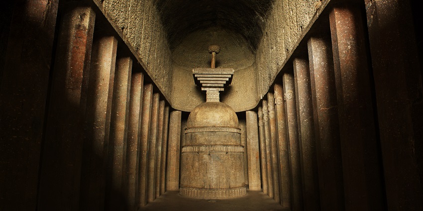 A picture of ancient rock-cut Bedse Caves, a cultural and historical attraction.