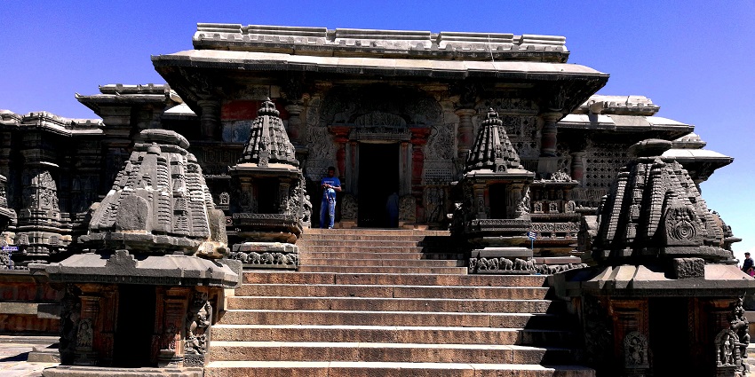 Hoysala temples in Belur and Halebidu showcase intricate carvings amid lush greenery.