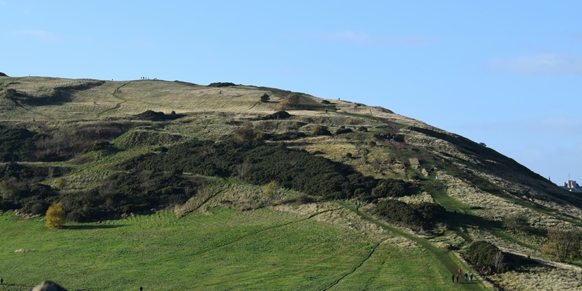 A glimpse of the Belvedere Point featuring majestic mountains adorned with greenery.