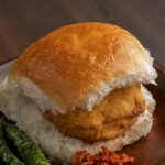 A picture of a plate of vada pav, the best food in Solapur