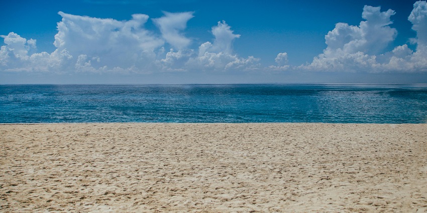 An image depicting sunny weather, indicating the best time to visit Amed Beach for outdoor fun.