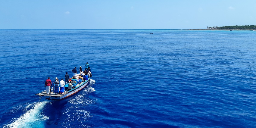 Scenic view of a blue boat in the blue Lakshadweep sea during day time
