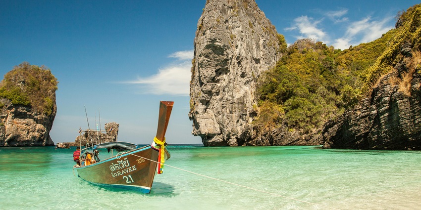 This is an image of sunny Lovina Beach in Bali. With calm waters and few visitors, it is ideal for visiting