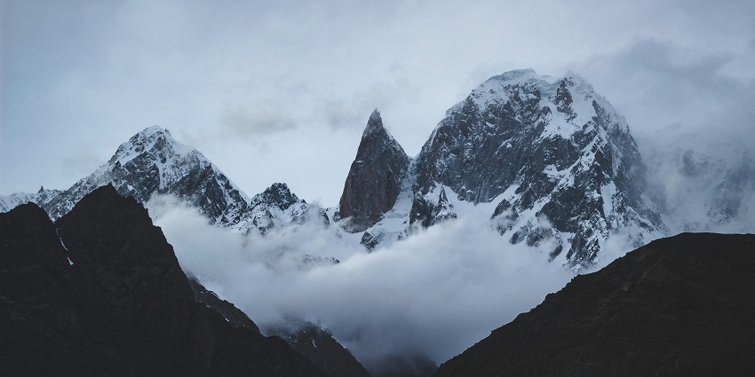 A breathtaking view of Karakoram with enormous mountain ranges during the daytime.