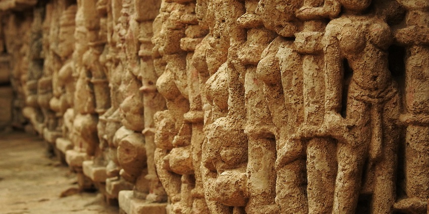 Image of rock sculptures carved on the walls of the Bhamchandra Caves showcasing idols
