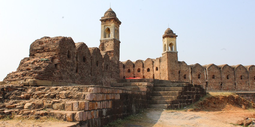 Distant view of the fort walls against the clear blue sky