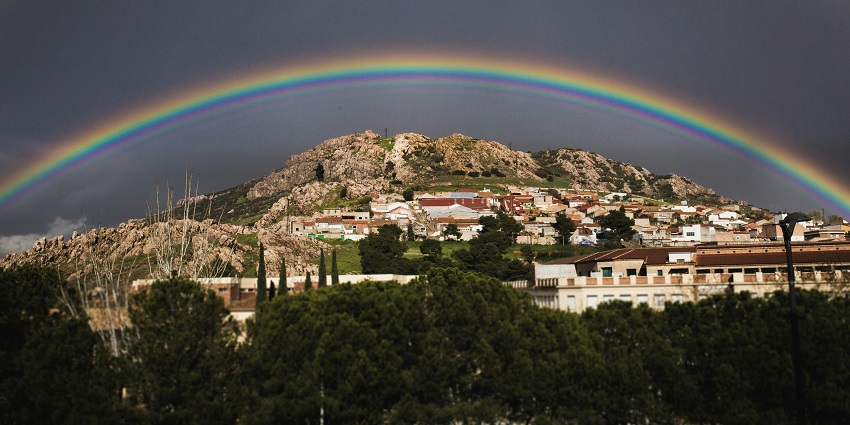 A view of a rainbow over Maharashtra, showcasing a blend of nature and urban beauty.