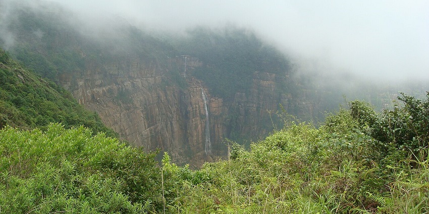 A pleasant view of waterfall during monsoon season for travellers to explore.