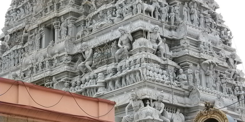 Detailed carvings on the gopuram of the Parthasarathy Temple