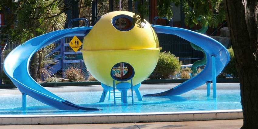 Close-up of water ride in a turquoise swimming pool, for a relaxing day.