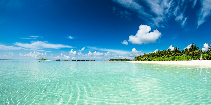 An image showing bright sunny skies over Melasti Beach, ideal for beach activities.