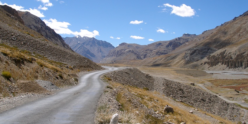  Image of Leh-Manali Highway with twisty road and rocky hills under blue sky