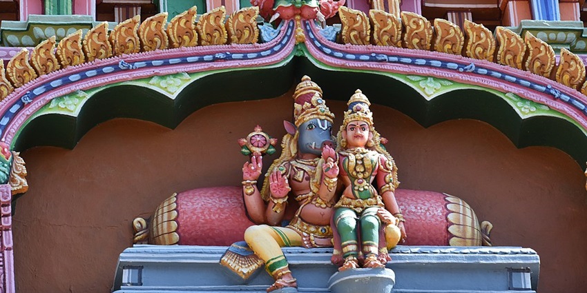 View of vibrant sculptures inside the temple building depicting mythological tales