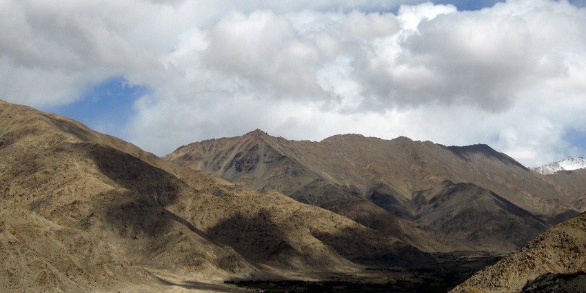 A beautiful view of the mountains in Ladakh with clouds hovering over