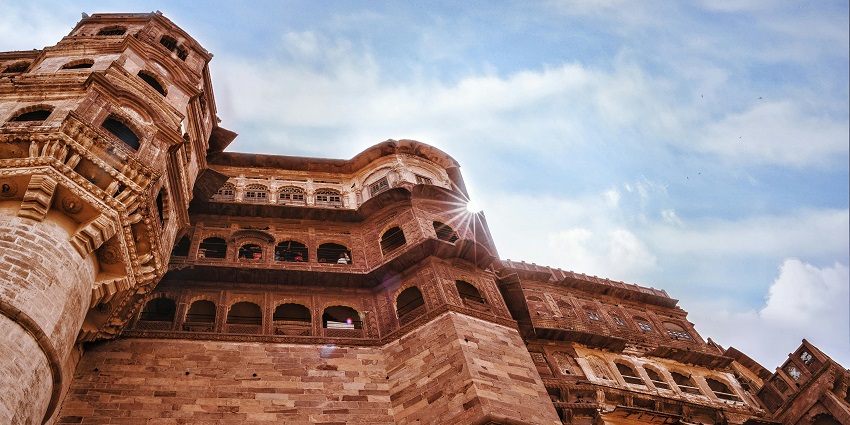An image showing a captivating low-angle view of a brown edifice inspired by the majestic Chakan Fort.