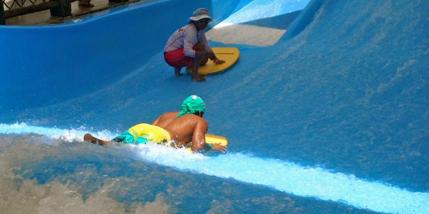 A person having fun at a water park in India.