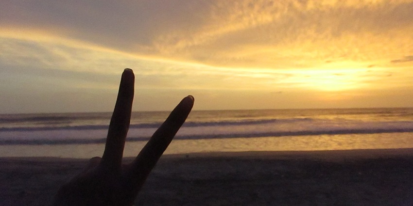 Beautiful sunset at Kashid Beach with golden skies reflecting over the calm sea and shore
