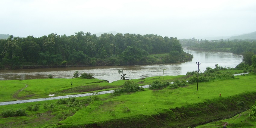 Snapshot of the lush green landscape and the tranquil waters near the Shrivardhan Fort