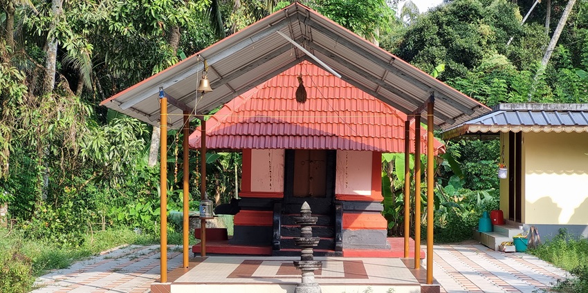 A frontal picture of a temple with an idol placed for worshipping