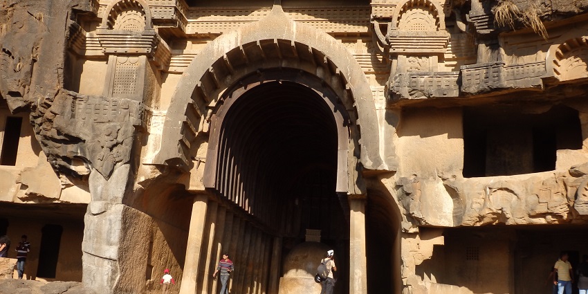 A glimpse of Bhaja Caves: ancient rock-cut caves with intricate carvings and stupas.