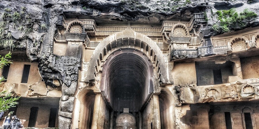 Ancient Bhaja Caves featuring rock-cut architecture and offering stunning views.