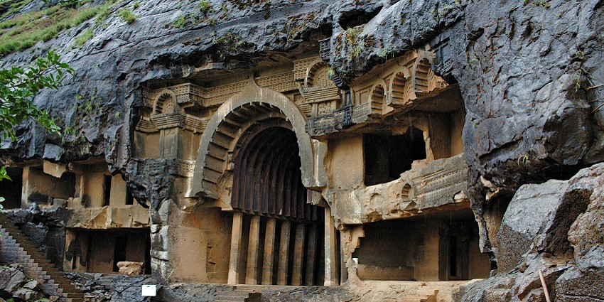 An image of Bhaje Caves near the Visapur Fort trek shows rock-cut caves and scenic beauty.
