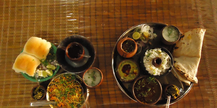 Image of platter comforting flavours of bhakri and fish curry, the best food in Alibaug