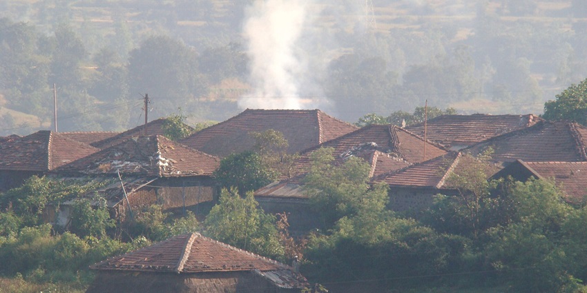 Charming village nestled near Bhandardhara Hills, showcasing serene landscapes.