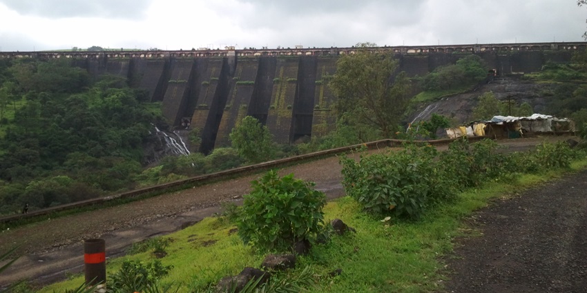 Scenic dam surrounded by lush landscapes and picturesque views