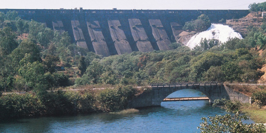 Water flowing down in the lake of Wilson Dam at Bhandardara with a bridge in view