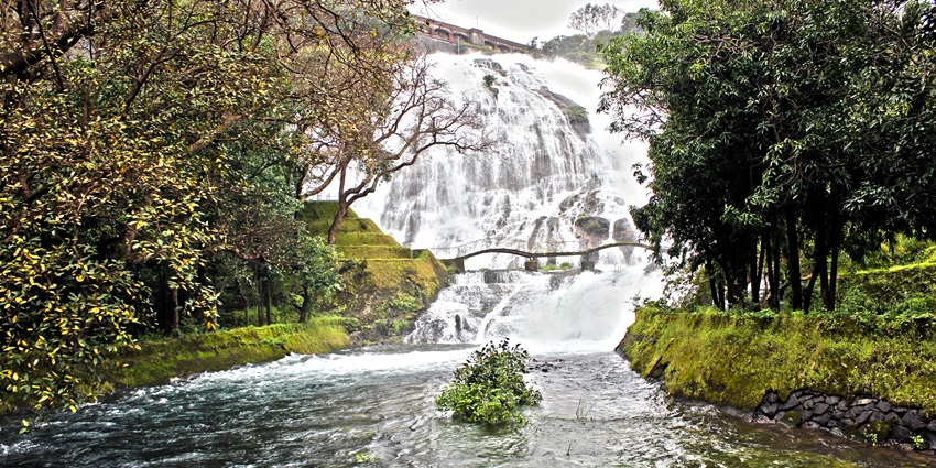 A scenic view of Umbrella Falls in Bhandardara, India, cascading down rocky cliffs