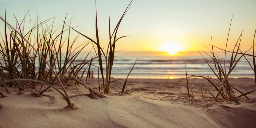 A picture of Bhatye Beach with golden sands, gentle waves, and spectacular sunset views.