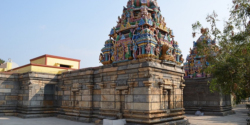 Sacred temple at river confluence, known for rituals and architecture.