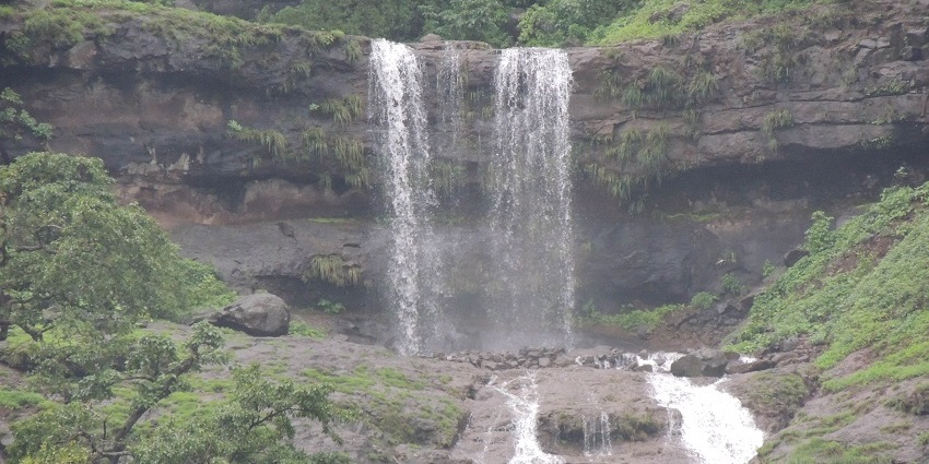 Bhilar Falls is a stunning waterfall surrounded by lush greenery, perfect in monsoon.