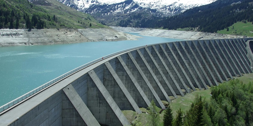 An image of the Bhira Dam surrounded by greenery and scenic views in Maharashtra