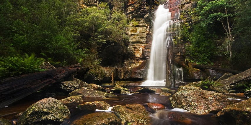 Bhivpuri Waterfalls with lush greenery around.