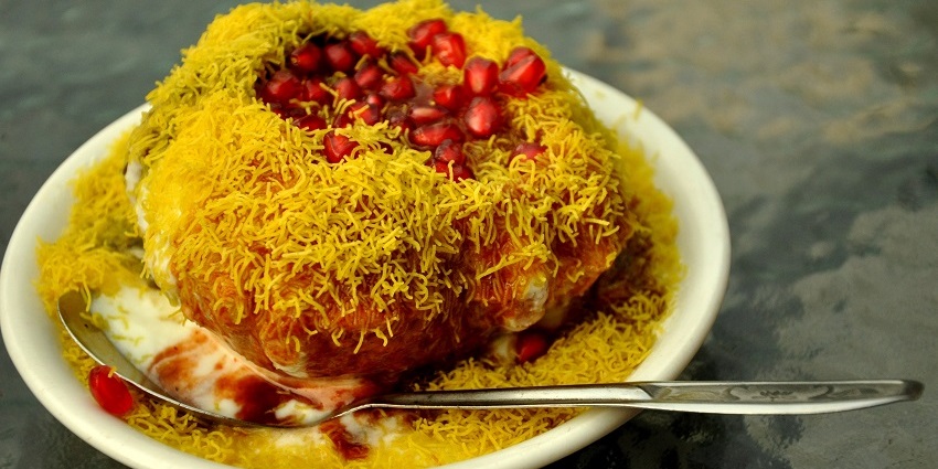 Crispy, golden kachoris served with chutneys, sweetened curd, pomegranate seeds and sev