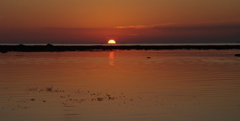 A stunning sunset at Bingin Beach, with bright blue waters and golden sands-an adventurer's paradise