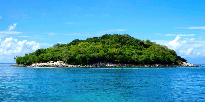A glimpse of Kadmat Island decked with lush greenery surrounded by azure waters.