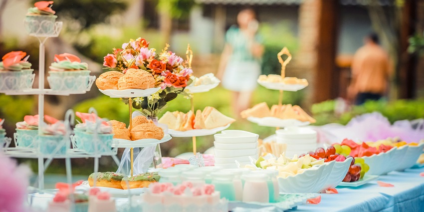 A table decorated with various delicious dishes during party in Jaipur