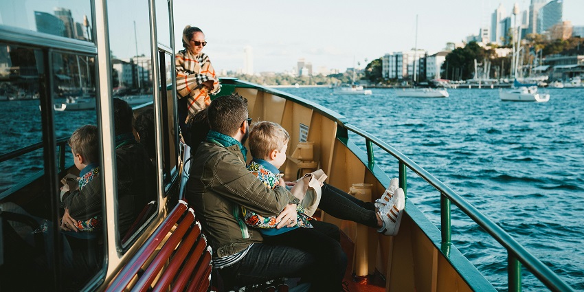 An image of tourists enjoying a boat ride on Lavasa's lake, one of the top Lavasa water sports.