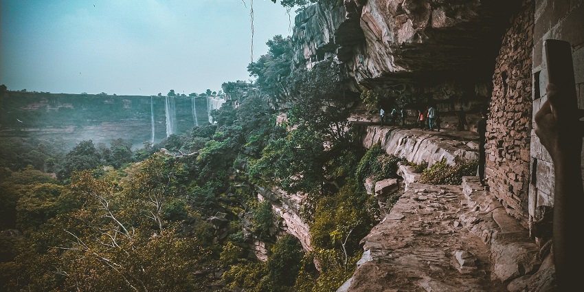 An image view of Brihaspati Kund, surrounded by greenery and inviting visitors to relax
