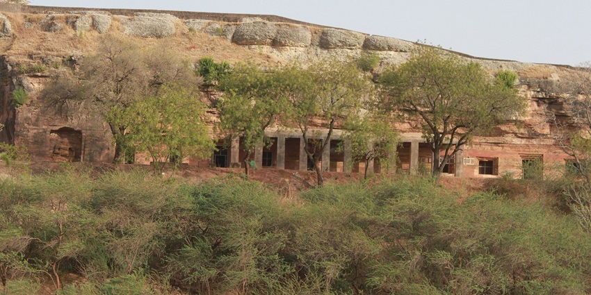 View of the ancient Buddhist caves offering a glimpse into the historical architecture.