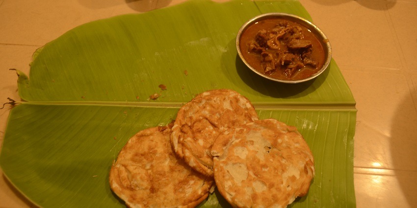 Soft, layered flatbread often served with spicy curries.