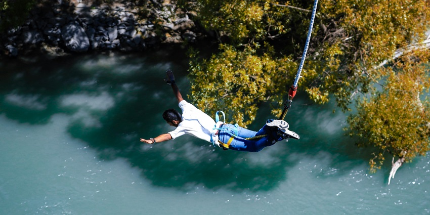A person trying bungee jumping, one of the exciting things to do in Goa in April.