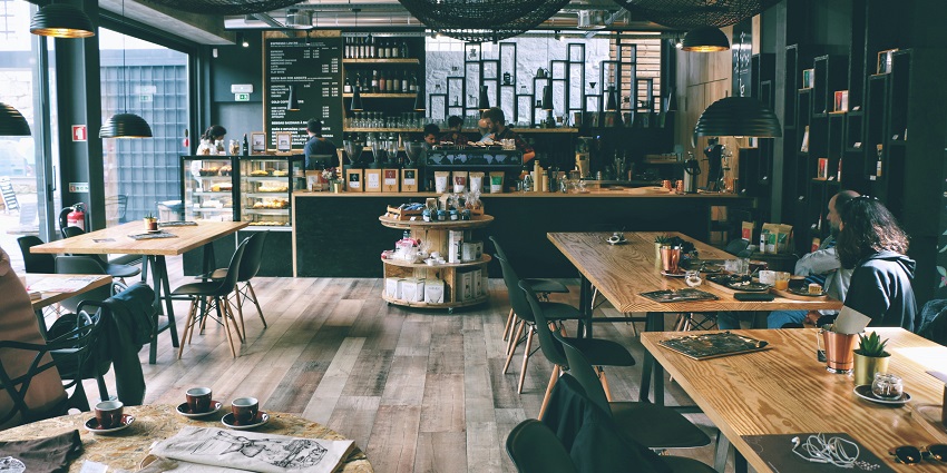 An inside view of the acclaimed Cafe JC’s with wooden aesthetics and rustic colours.