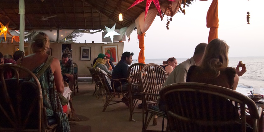 A beautiful beach view from the dining area at Cafe Lilliput in Anjuna, Goa, India.