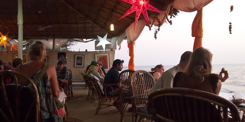 People enjoying sunset at Cafe Lilliput , a perfect party place in North Goa